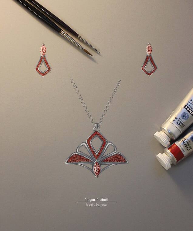 Photo d'un dessin d'un bijoux formant une fleur de lys or et rouge